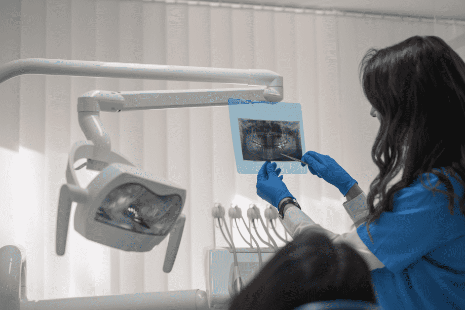 Dentist going over records