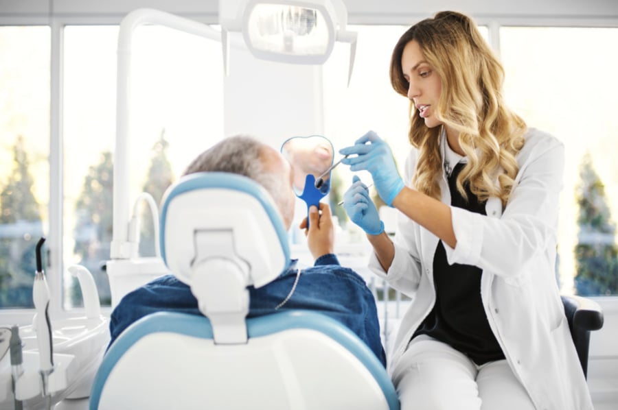 Dentist consulting a patient