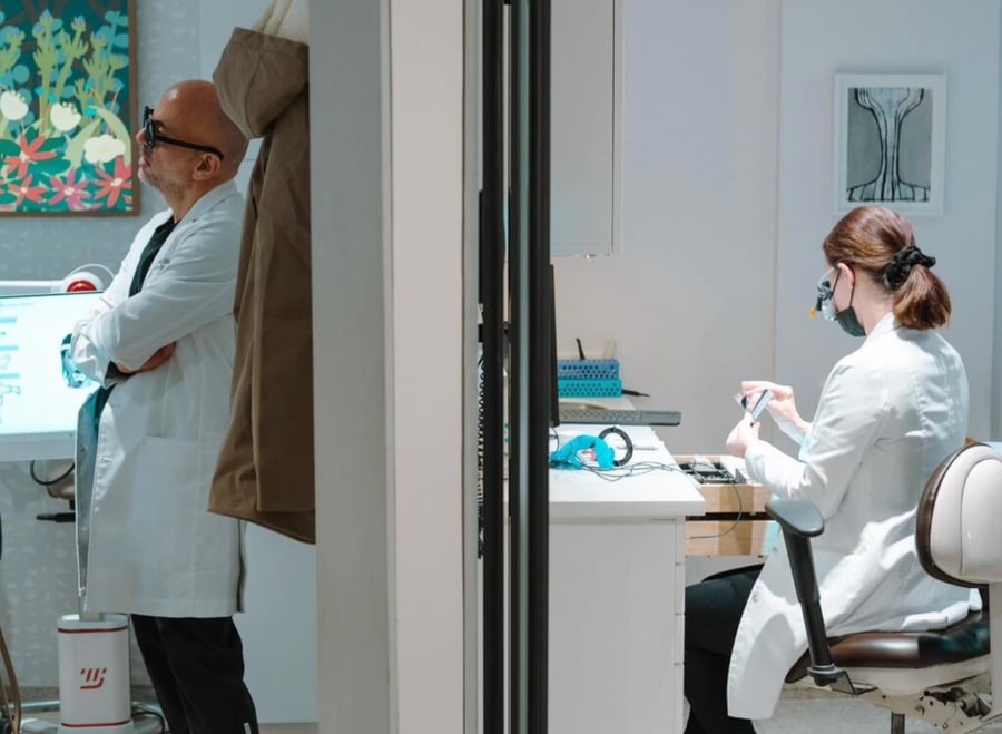 Dr. Tabib and Dr. Mello working at NYC Smile Design