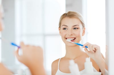 Woman brushing teeth